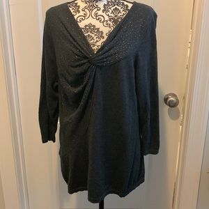 Woman’s dark grey sweater with twist v neckline.